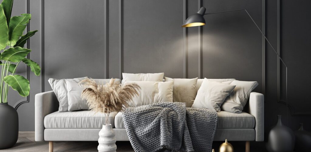 Wohnzimmer einrichten – gemütliches Licht durch Wandlampe neben dem Sofa